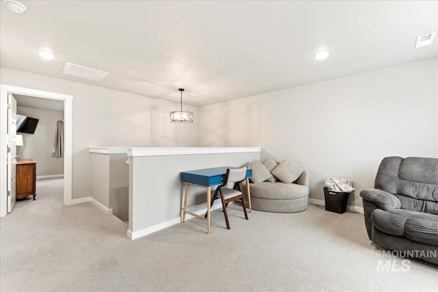 living area with visible vents, baseboards, an upstairs landing, light carpet, and recessed lighting