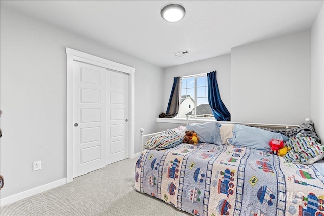 bedroom with visible vents, baseboards, and carpet