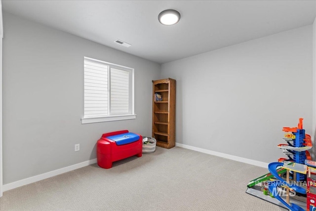 rec room with visible vents, carpet floors, and baseboards