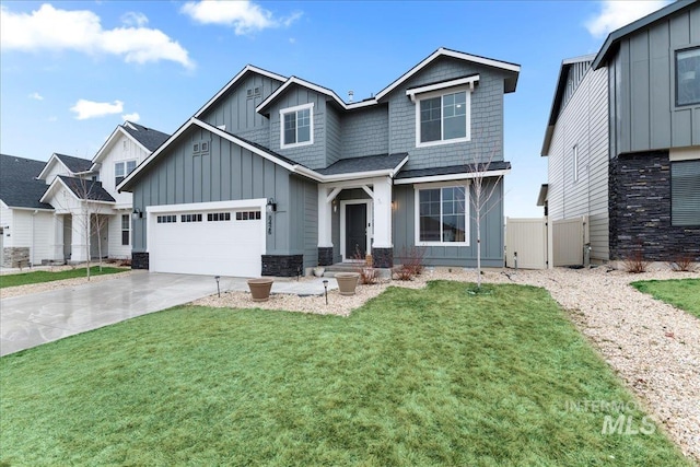 craftsman-style house featuring board and batten siding, concrete driveway, a front yard, and fence