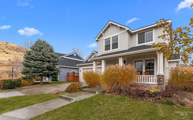 view of front of property with a front lawn and a porch