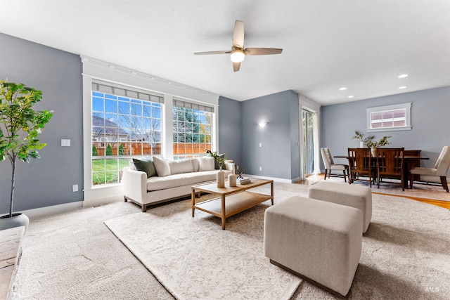 living room with carpet floors and ceiling fan