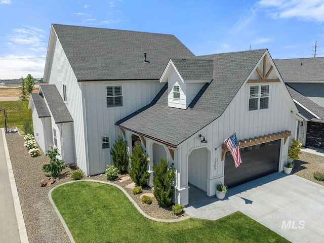 1305 N Big Star Pl, Eagle, ID 83616 - modern farmhouse style home with roof with shingles, driveway, board and batten siding, a front lawn, and an attached garage