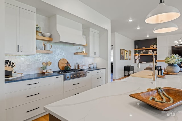 1305 N Big Star Pl, Eagle, ID 83616 - kitchen featuring stainless steel gas stovetop, open shelves, white cabinetry, dark stone counters, and backsplash