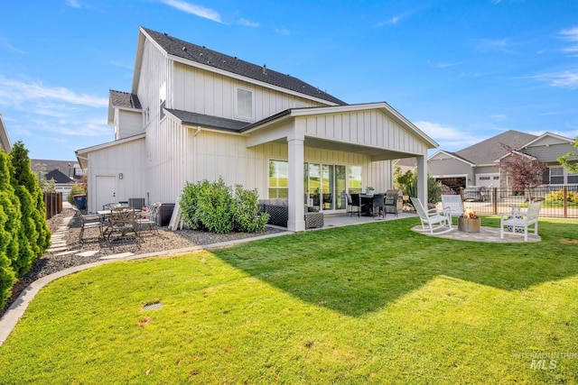 1305 N Big Star Pl, Eagle, ID 83616 - rear view of property featuring a patio area, board and batten siding, and roof with shingles