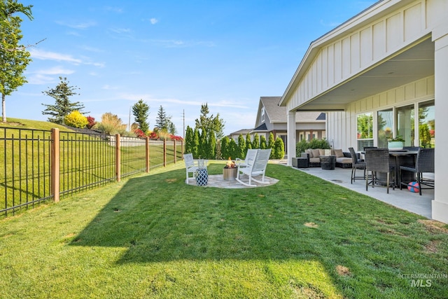 1305 N Big Star Pl, Eagle, ID 83616 - fenced backyard with an outdoor living space with a fire pit and a patio area