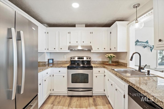 632 N Edgewood Ln, Eagle, ID 83616 - kitchen with appliances with stainless steel finishes, under cabinet range hood, and white cabinets