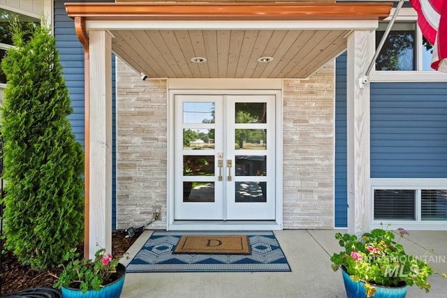 632 N Edgewood Ln, Eagle, ID 83616 - property entrance featuring french doors, brick siding, and stone siding