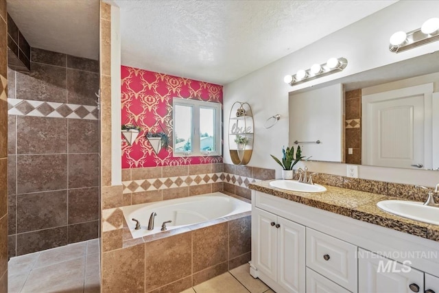 632 N Edgewood Ln, Eagle, ID 83616 - bathroom with a bath, double vanity, a tile shower, a textured ceiling, and tile patterned flooring
