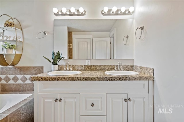 632 N Edgewood Ln, Eagle, ID 83616 - bathroom with double vanity and a relaxing tiled tub
