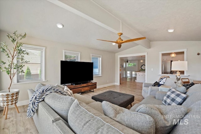 632 N Edgewood Ln, Eagle, ID 83616 - living area with light wood-style floors, a ceiling fan, and plenty of natural light