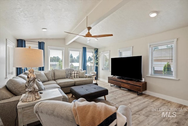 632 N Edgewood Ln, Eagle, ID 83616 - living area with a textured ceiling, light wood-style floors, and ceiling fan