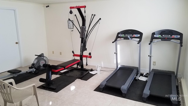 exercise area with light tile patterned floors