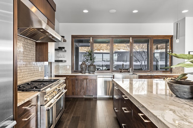 510 W Paso Fino Dr, Boise, ID 83702 - kitchen with sink, appliances with stainless steel finishes, light stone counters, island exhaust hood, and decorative backsplash