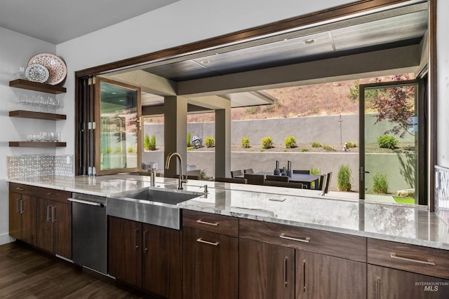 510 W Paso Fino Dr, Boise, ID 83702 - interior space with dark hardwood / wood-style flooring, sink, dark brown cabinets, and backsplash
