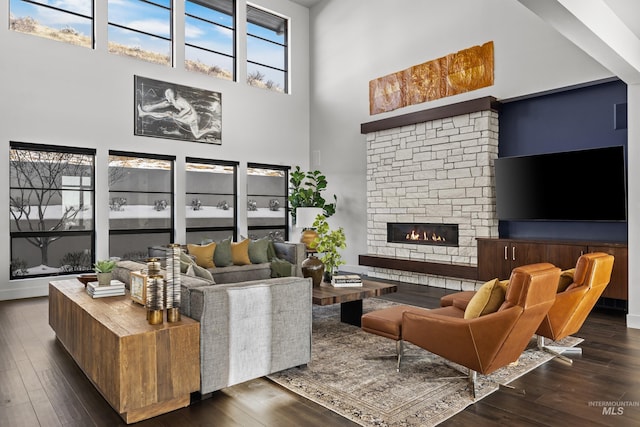 510 W Paso Fino Dr, Boise, ID 83702 - living room with a high ceiling, dark wood-type flooring, and a fireplace