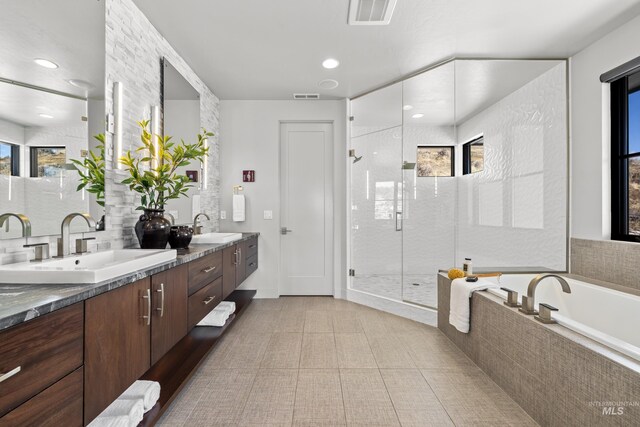 510 W Paso Fino Dr, Boise, ID 83702 - bathroom featuring vanity, plus walk in shower, and plenty of natural light
