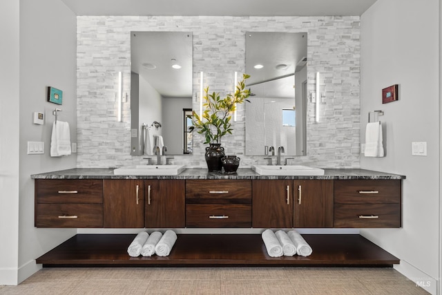 510 W Paso Fino Dr, Boise, ID 83702 - bathroom featuring tasteful backsplash and vanity