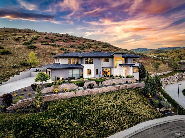 510 W Paso Fino Dr, Boise, ID 83702 - view of front of house featuring a balcony, a mountain view, and a yard