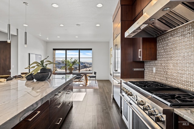 510 W Paso Fino Dr, Boise, ID 83702 - kitchen featuring wall chimney exhaust hood, light stone counters, decorative light fixtures, double oven range, and backsplash