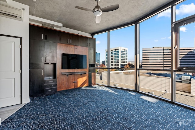 living room with expansive windows, dark colored carpet, a wall unit AC, and a ceiling fan