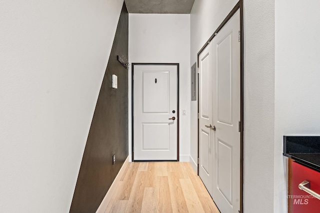 entryway with light wood-style floors