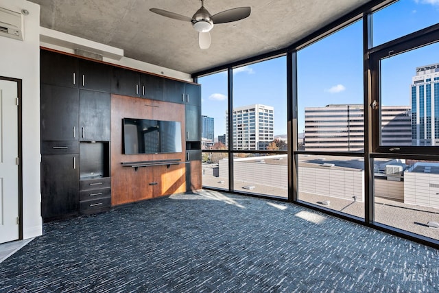 interior space with ceiling fan