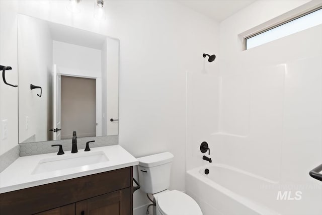 full bath featuring toilet, shower / bathtub combination, and vanity