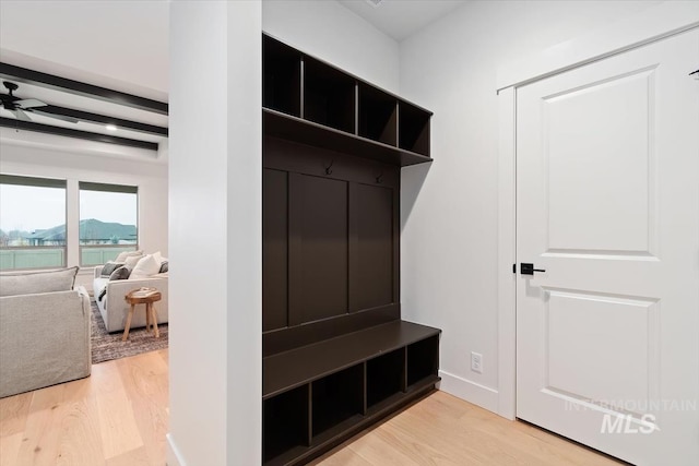 mudroom with light wood finished floors, baseboards, a ceiling fan, and beam ceiling