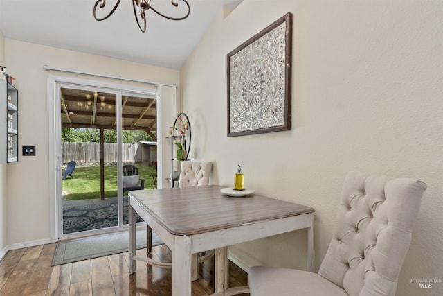 5609 Landsdown Ave, Caldwell, ID 83607 - dining area featuring wood finished floors, a chandelier, and baseboards
