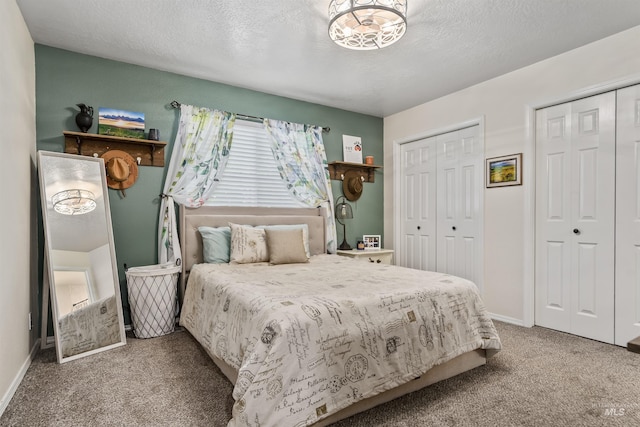 5609 Landsdown Ave, Caldwell, ID 83607 - carpeted bedroom with multiple closets, a textured ceiling, and baseboards