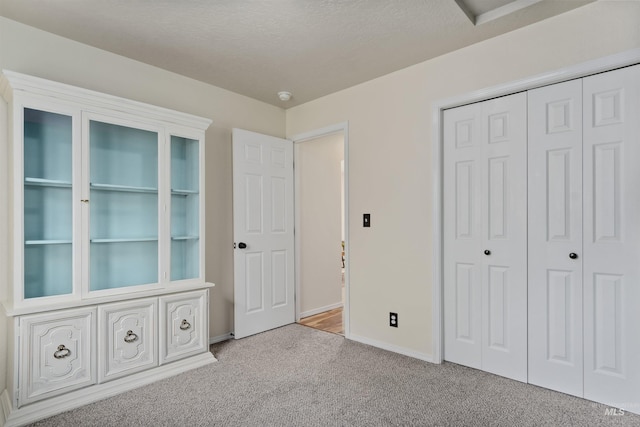5609 Landsdown Ave, Caldwell, ID 83607 - unfurnished bedroom featuring carpet flooring, baseboards, and a closet