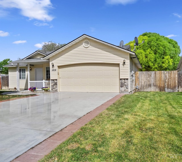 5609 Landsdown Ave, Caldwell, ID 83607 - ranch-style house with covered porch, stone siding, concrete driveway, and an attached garage