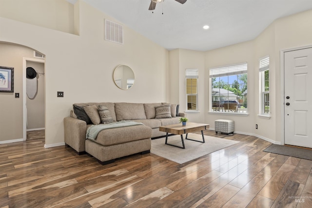 5609 Landsdown Ave, Caldwell, ID 83607 - living area featuring a ceiling fan, wood finished floors, baseboards, and arched walkways