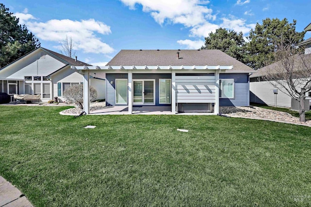 rear view of house featuring a pergola, a yard, and a patio