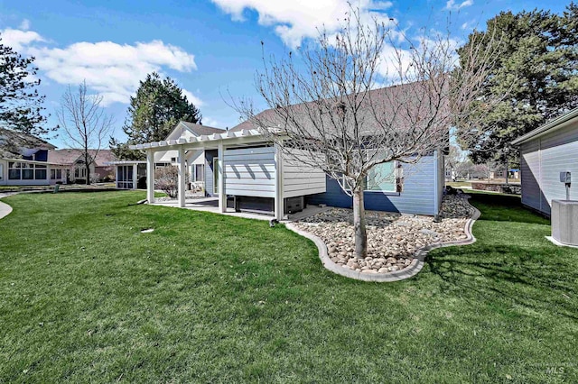 rear view of property featuring a patio, cooling unit, a pergola, and a lawn