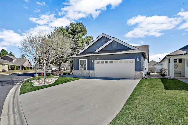 craftsman-style house with a front yard, driveway, an attached garage, and stone siding
