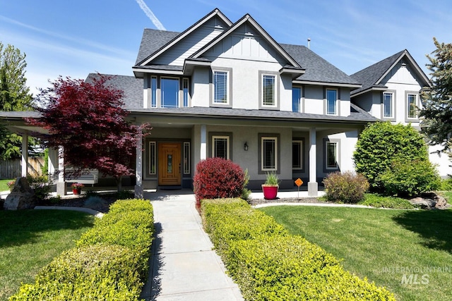2581 N Tricia Way, Meridian, ID 83646 - view of front of house featuring a porch, a front lawn, and roof with shingles