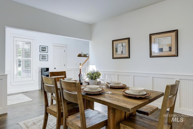 2581 N Tricia Way, Meridian, ID 83646 - dining room with wainscoting, a decorative wall, and dark wood-style flooring