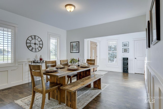 2581 N Tricia Way, Meridian, ID 83646 - dining room featuring wainscoting, dark wood-type flooring, and a decorative wall