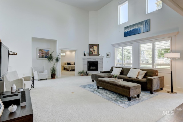 2581 N Tricia Way, Meridian, ID 83646 - living room featuring a towering ceiling, carpet floors, and a fireplace
