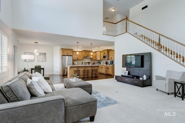 2581 N Tricia Way, Meridian, ID 83646 - carpeted living room with a towering ceiling and stairway