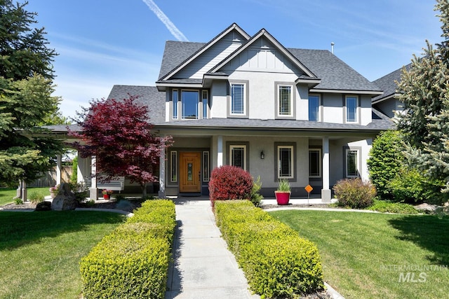 2581 N Tricia Way, Meridian, ID 83646 - view of front of house featuring a front lawn, a porch, a shingled roof, board and batten siding, and stucco siding