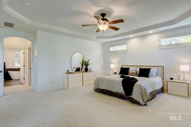 2581 N Tricia Way, Meridian, ID 83646 - bedroom featuring a raised ceiling, arched walkways, carpet flooring, multiple windows, and ornamental molding