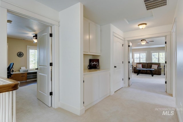 2581 N Tricia Way, Meridian, ID 83646 - hall with a desk, light colored carpet, and attic access