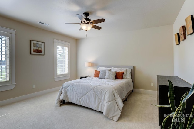 2581 N Tricia Way, Meridian, ID 83646 - bedroom featuring light colored carpet, baseboards, and ceiling fan
