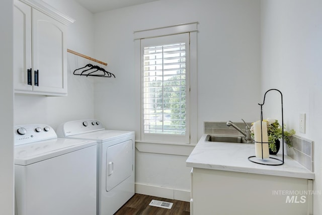 2581 N Tricia Way, Meridian, ID 83646 - clothes washing area with cabinet space, washer and dryer, dark wood-type flooring, and baseboards