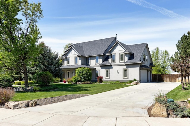 2581 N Tricia Way, Meridian, ID 83646 - view of front facade with concrete driveway, an attached garage, stucco siding, and roof with shingles
