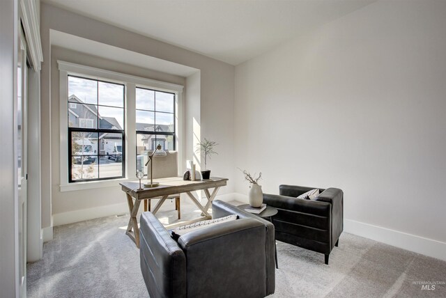 office area with carpet flooring and baseboards