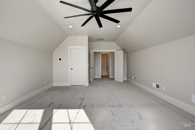 bonus room with light carpet, vaulted ceiling, ceiling fan, and baseboards